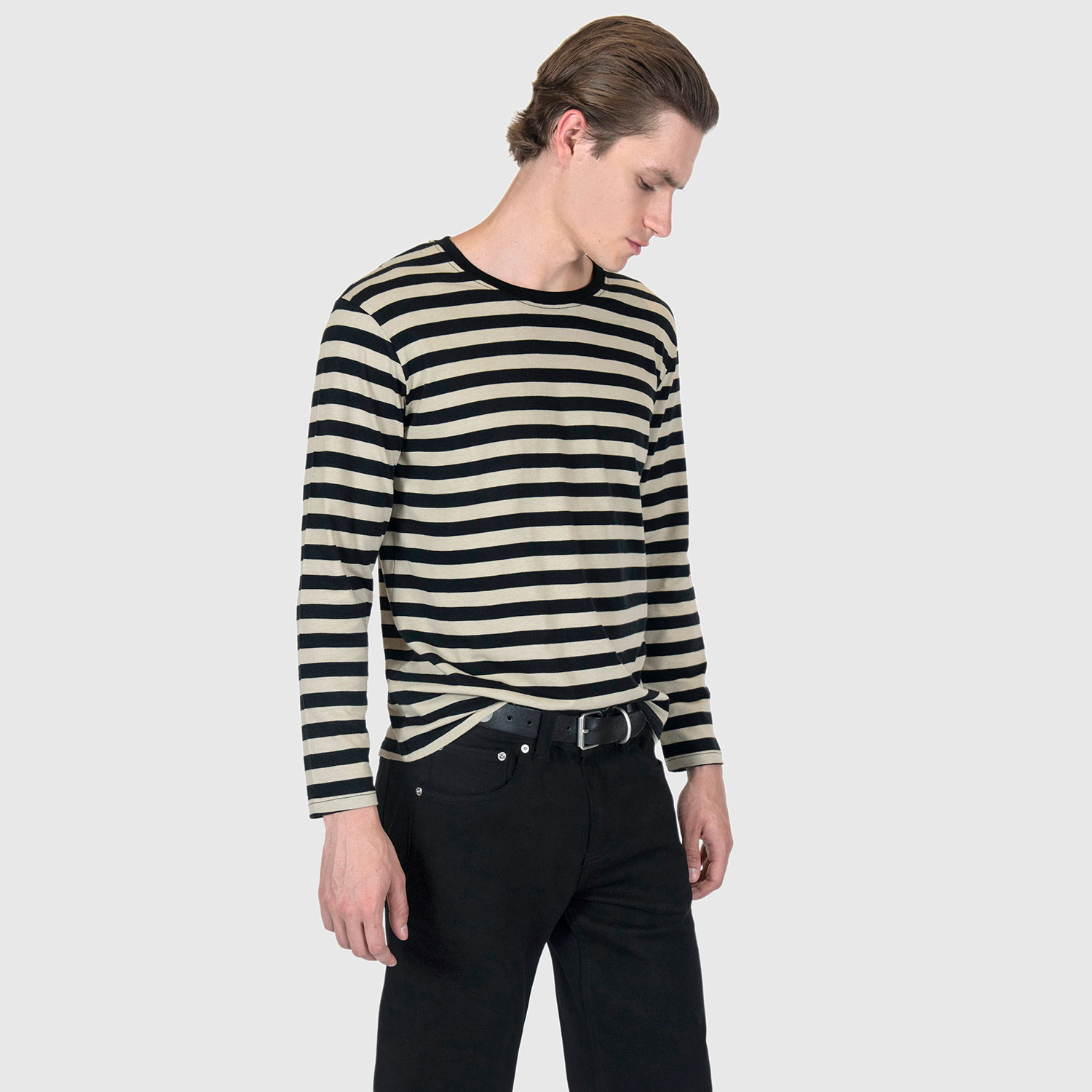 The Fitz 77 is a black and cream striped, long sleeve t-shirt. This soft cotton-poly blend allows the fabric to drape comfortably on your torso. It features a subtle 77 embroidered on the lower corner. This is our Bucktown fit.