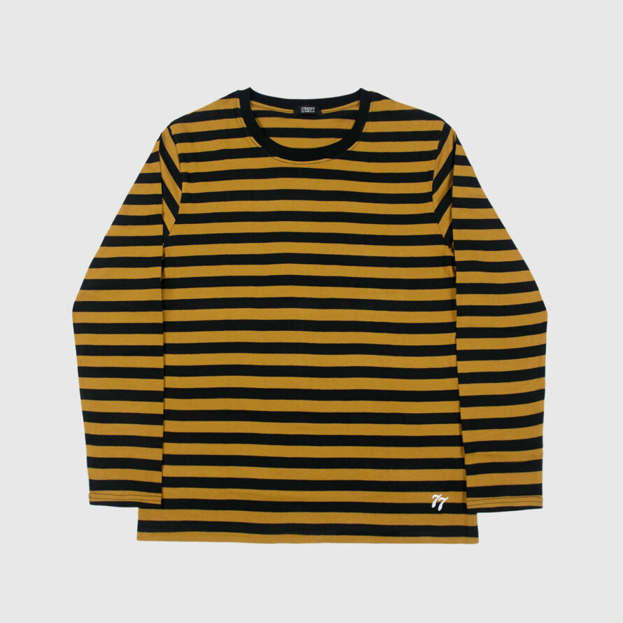 The Fitz 77 is a black and yellow striped, long sleeve t-shirt. This soft cotton-poly blend allows the fabric to drape comfortably on your torso. It features a subtle 77 embroidered on the lower corner. This is our Bucktown fit.
