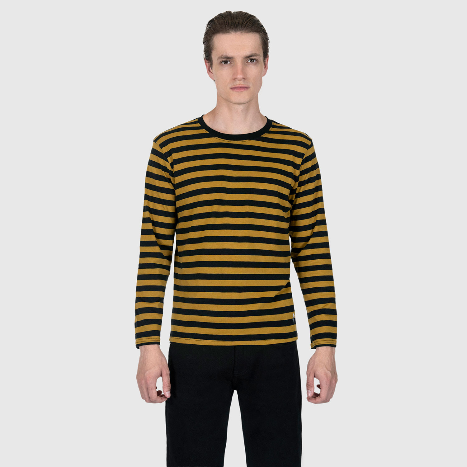 The Fitz 77 is a black and yellow striped, long sleeve t-shirt. This soft cotton-poly blend allows the fabric to drape comfortably on your torso. It features a subtle 77 embroidered on the lower corner. This is our Bucktown fit.