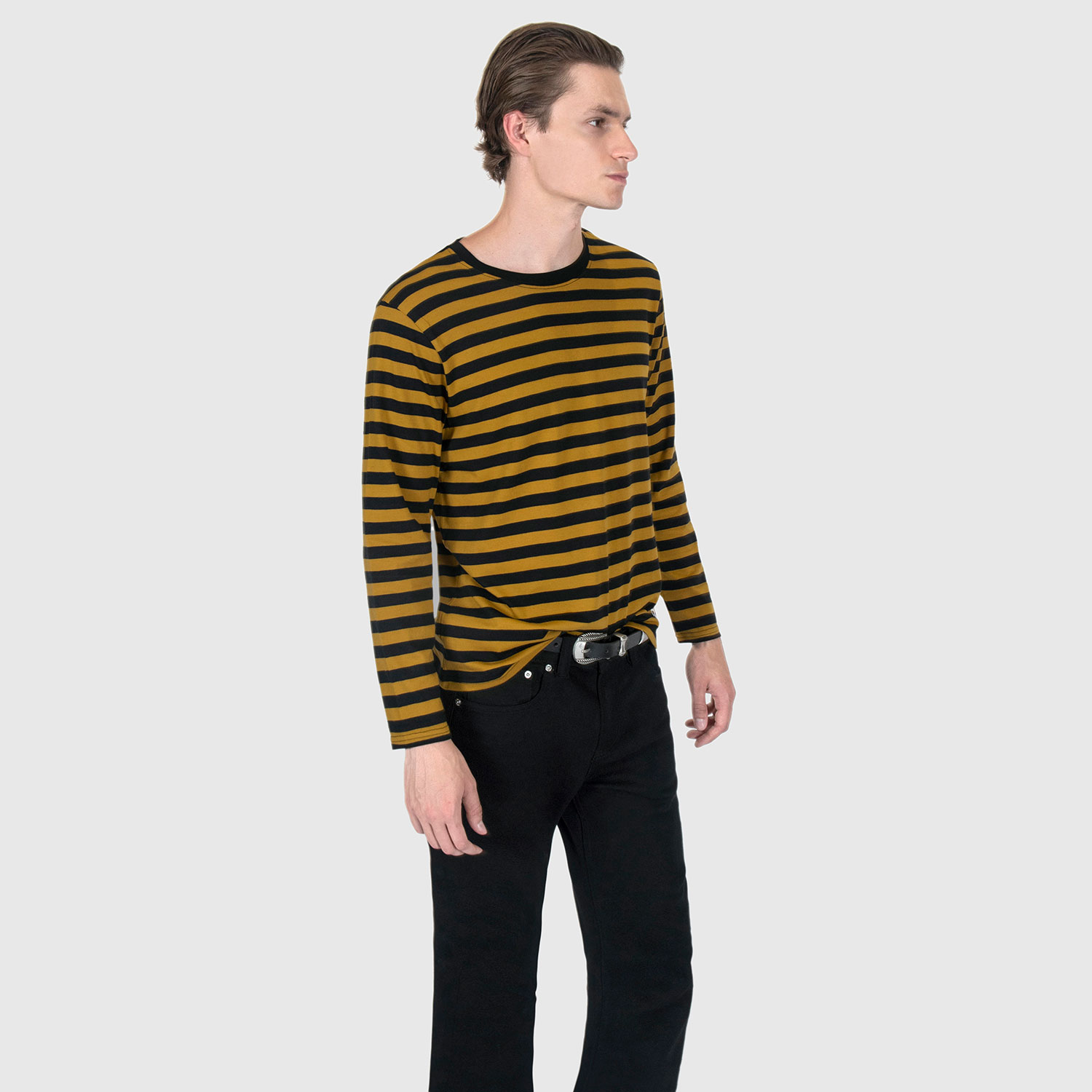 The Fitz 77 is a black and yellow striped, long sleeve t-shirt. This soft cotton-poly blend allows the fabric to drape comfortably on your torso. It features a subtle 77 embroidered on the lower corner. This is our Bucktown fit.