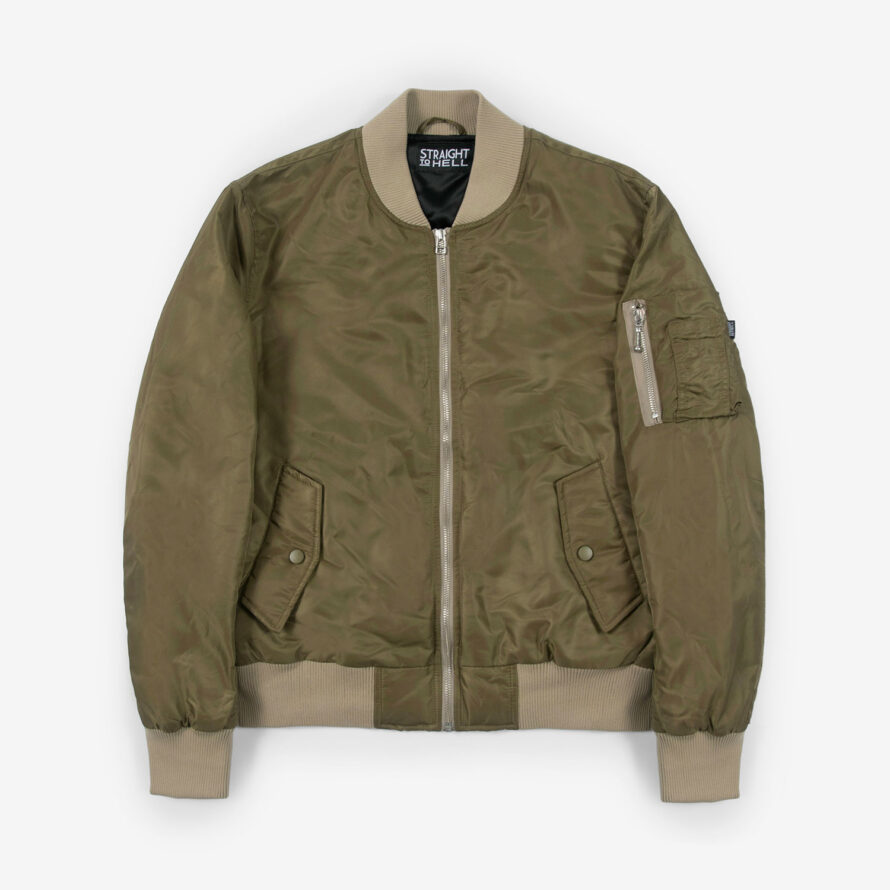 A nylon flight jacket with contrast ribbed elastic and silver hardware. The olive and sage green color combination gives this classic bomber style a more distinctive look. Side pockets and classic utility bicep pocket with STH woven label. An easy layer for when you want the structure of a jacket without the weight of a heavy coat. This is our Proper fit.