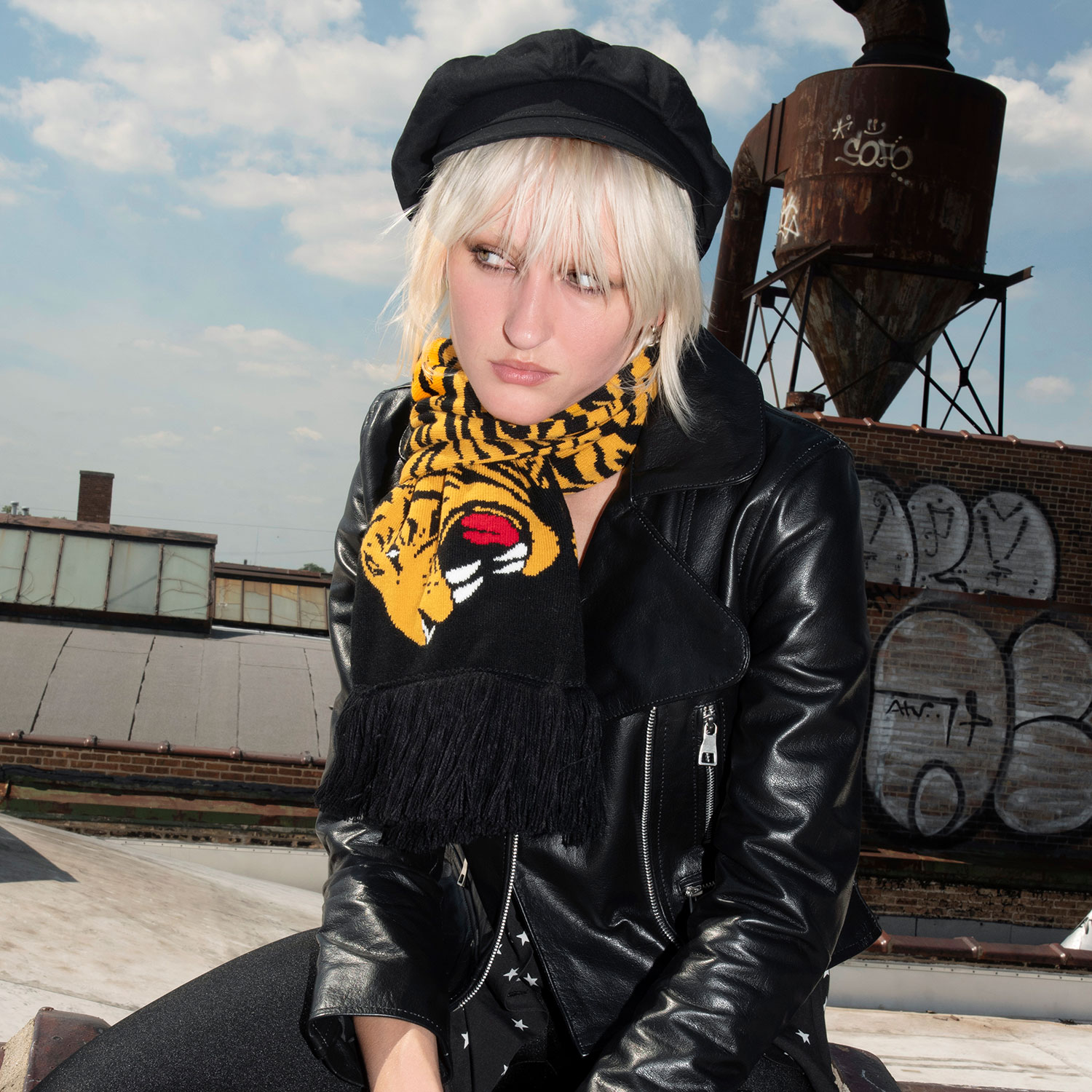 The Stray Tiger is a two-headed tiger soccer scarf with a discreet Straight To Hell statement. Some days a jacket isn't enough, and an ordinary scarf just won't do. Medium weight and measuring 57 inches. Made to be worn long in front or wrapped around the neck.