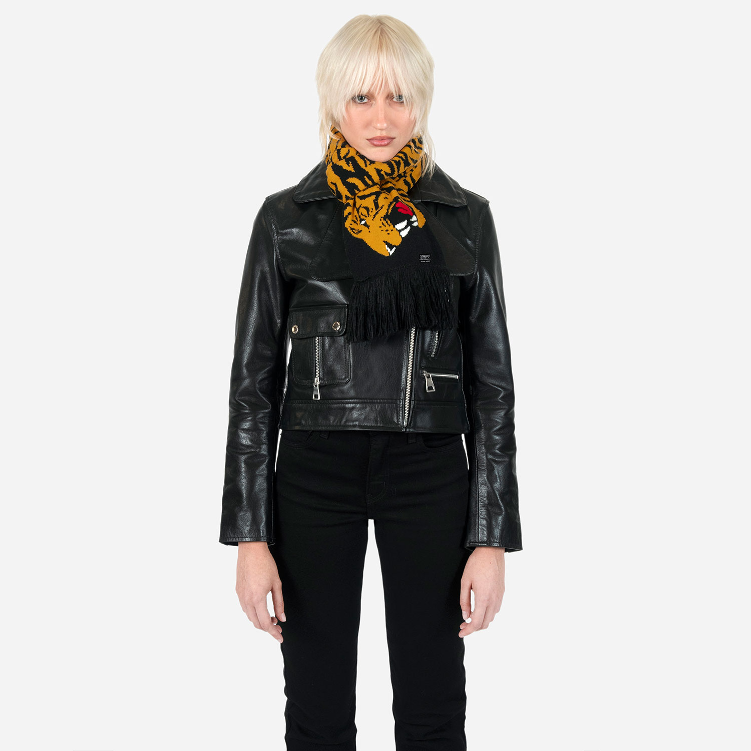 The Stray Tiger is a two-headed tiger soccer scarf with a discreet Straight To Hell statement. Some days a jacket isn't enough, and an ordinary scarf just won't do. Medium weight and measuring 57 inches. Made to be worn long in front or wrapped around the neck.
