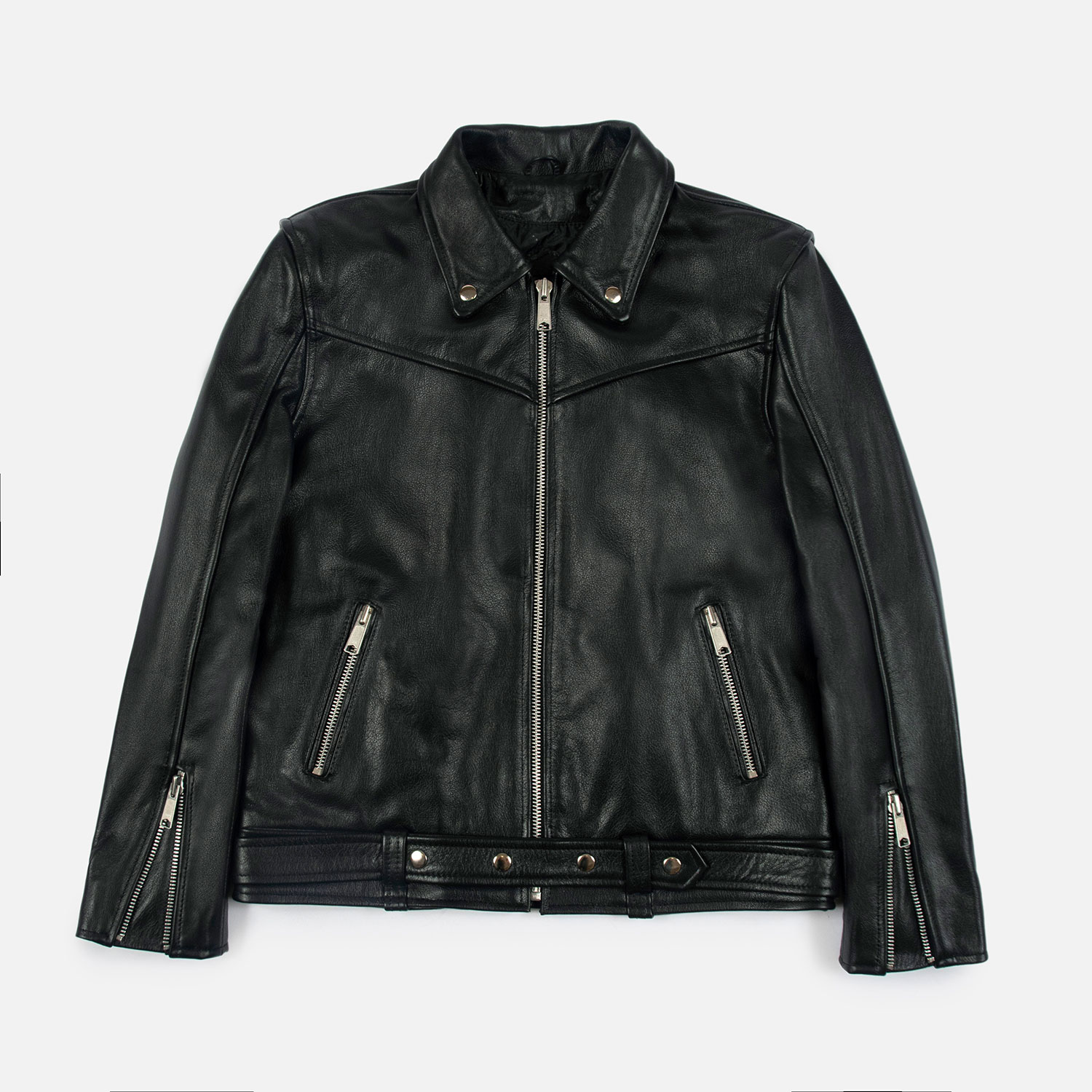 The Tribe leather jacket keeps things simple without sacrificing character. The diagonal chest seam detailing adds a subtle edge without complicating the design. A unique snap belt gives this classic style its own identity. Featuring a snap collar, vertical zipper closure, side pockets, and our Modern fit. All the attitude of a classic moto jacket, with a clean look that works just about anywhere. Made from premium leather that softens, relaxes, and conforms to your shape with wear, only getting better over time.