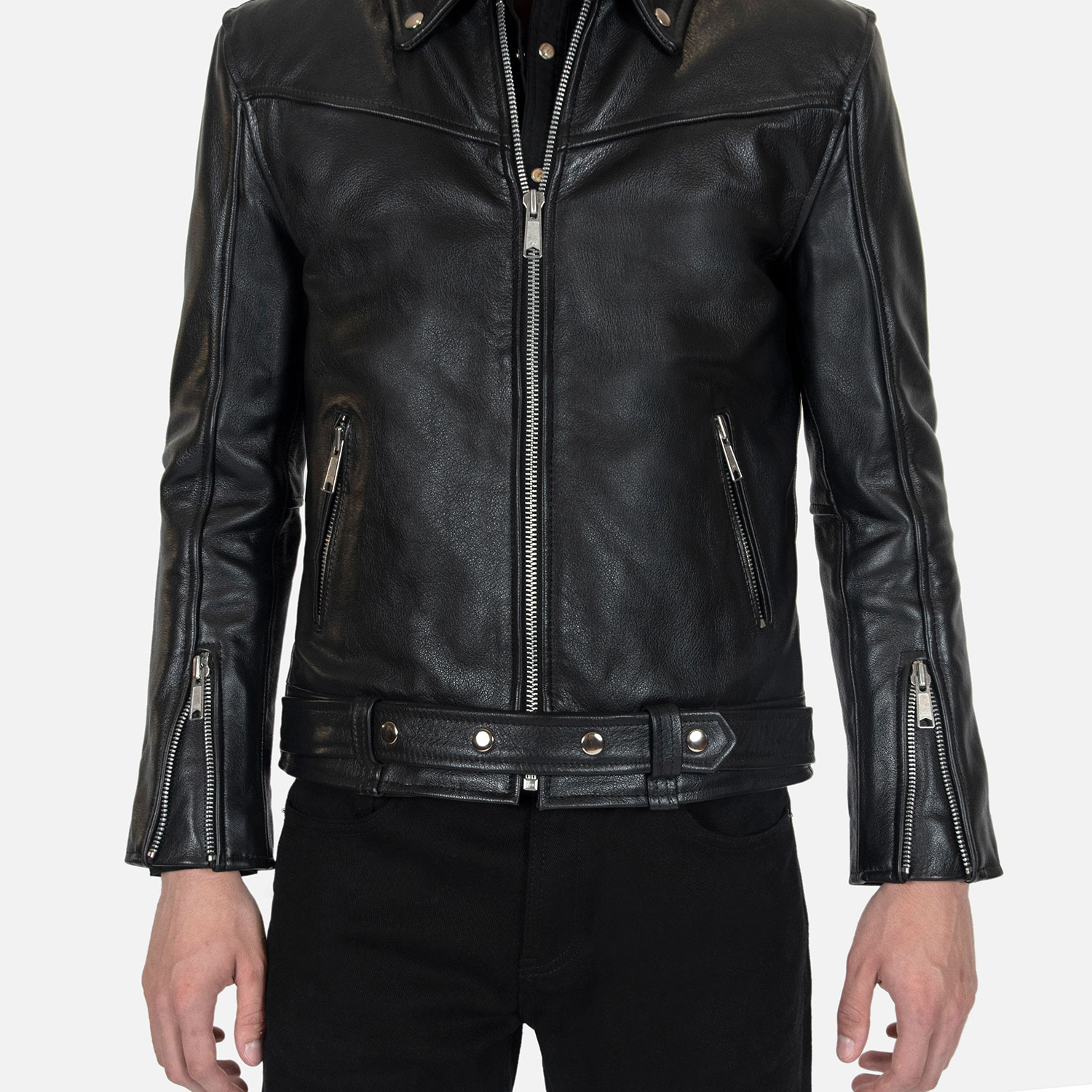 The Tribe leather jacket keeps things simple without sacrificing character. The diagonal chest seam detailing adds a subtle edge without complicating the design. A unique snap belt gives this classic style its own identity. Featuring a snap collar, vertical zipper closure, side pockets, and our Modern fit. All the attitude of a classic moto jacket, with a clean look that works just about anywhere. Made from premium leather that softens, relaxes, and conforms to your shape with wear, only getting better over time.