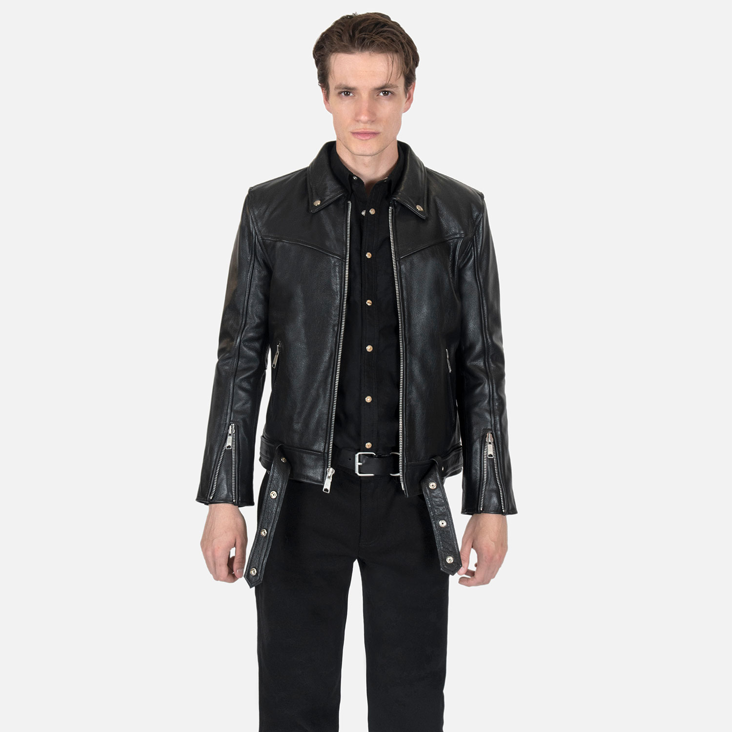 The Tribe leather jacket keeps things simple without sacrificing character. The diagonal chest seam detailing adds a subtle edge without complicating the design. A unique snap belt gives this classic style its own identity. Featuring a snap collar, vertical zipper closure, side pockets, and our Modern fit. All the attitude of a classic moto jacket, with a clean look that works just about anywhere. Made from premium leather that softens, relaxes, and conforms to your shape with wear, only getting better over time.