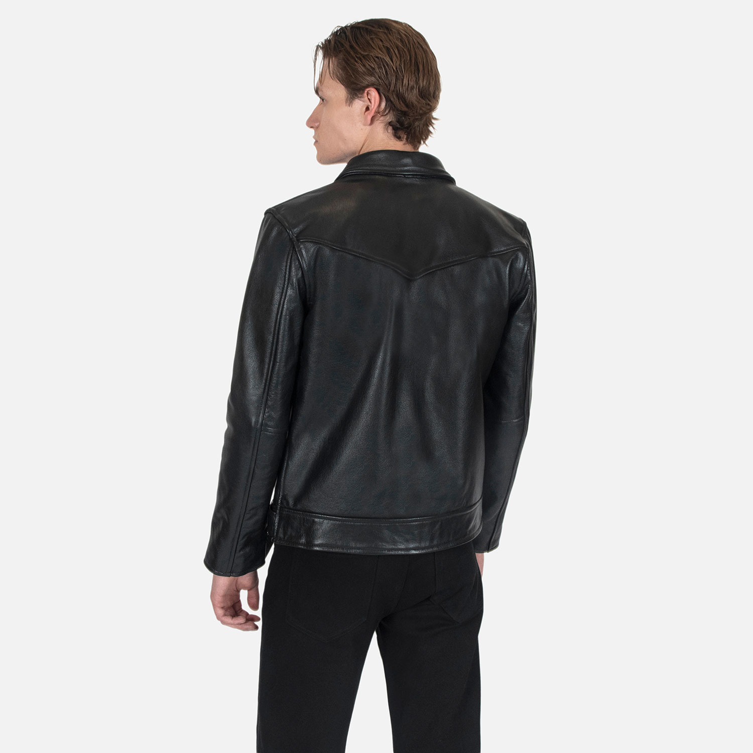 The Tribe leather jacket keeps things simple without sacrificing character. The diagonal chest seam detailing adds a subtle edge without complicating the design. A unique snap belt gives this classic style its own identity. Featuring a snap collar, vertical zipper closure, side pockets, and our Modern fit. All the attitude of a classic moto jacket, with a clean look that works just about anywhere. Made from premium leather that softens, relaxes, and conforms to your shape with wear, only getting better over time.