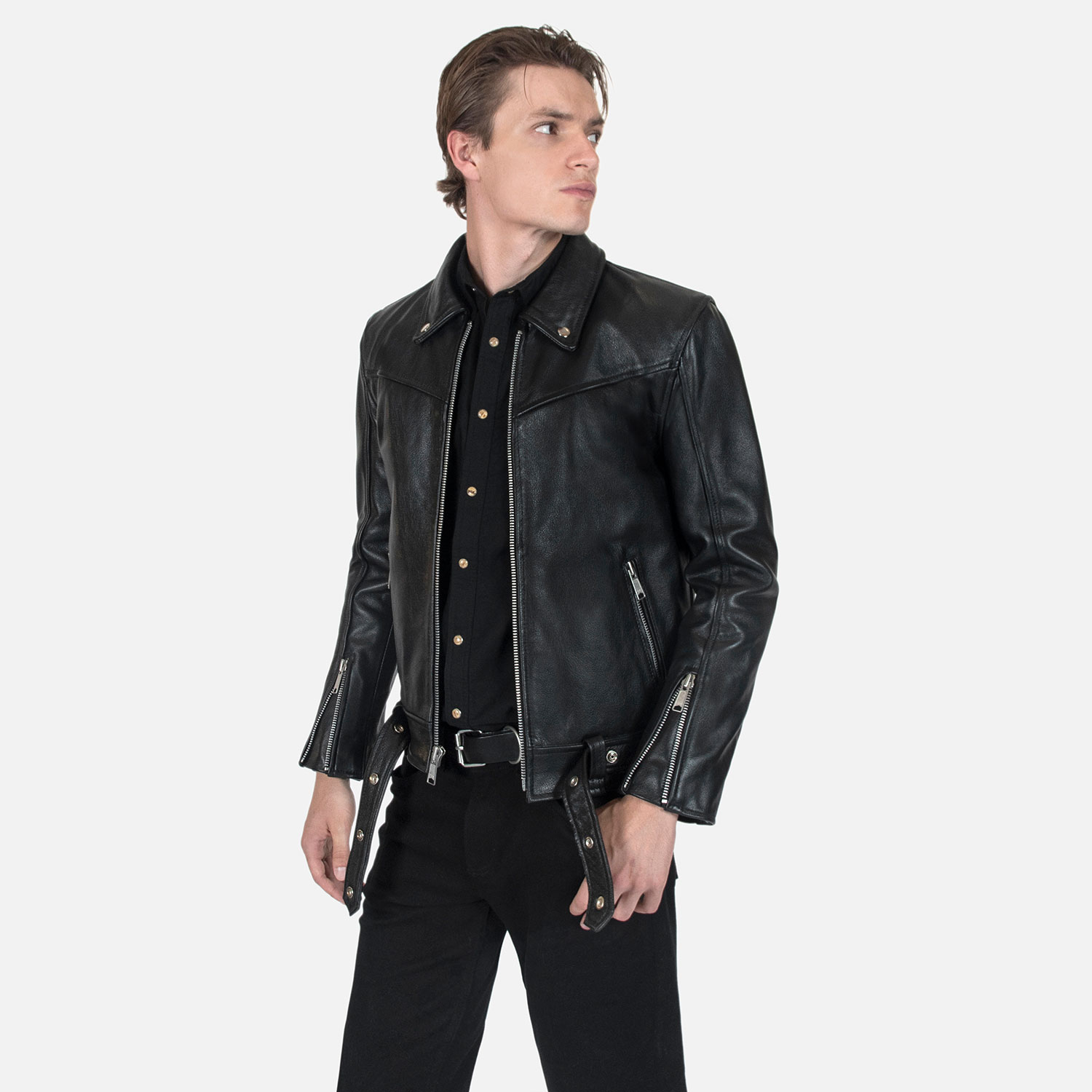 The Tribe leather jacket keeps things simple without sacrificing character. The diagonal chest seam detailing adds a subtle edge without complicating the design. A unique snap belt gives this classic style its own identity. Featuring a snap collar, vertical zipper closure, side pockets, and our Modern fit. All the attitude of a classic moto jacket, with a clean look that works just about anywhere. Made from premium leather that softens, relaxes, and conforms to your shape with wear, only getting better over time.