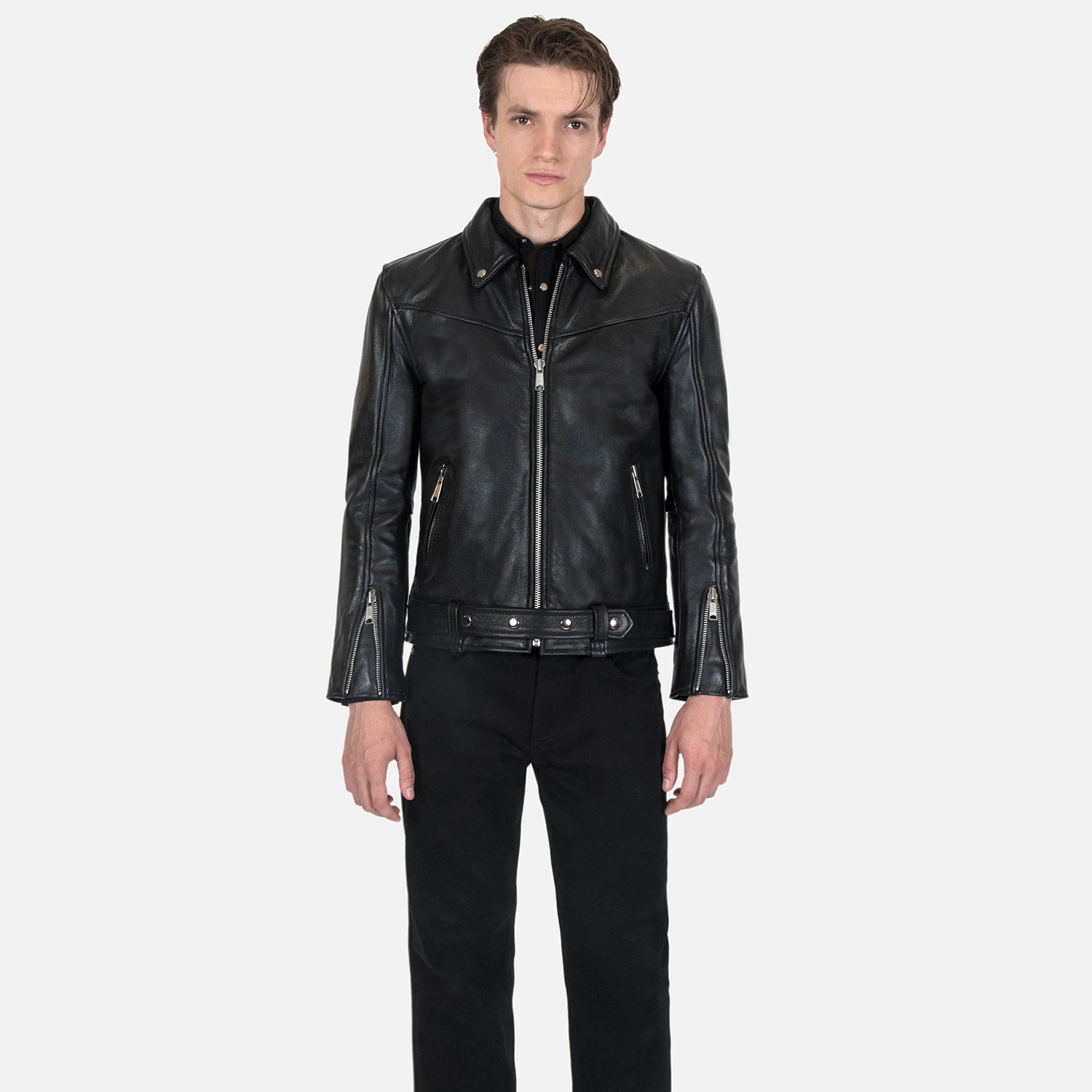 The Tribe leather jacket keeps things simple without sacrificing character. The diagonal chest seam detailing adds a subtle edge without complicating the design. A unique snap belt gives this classic style its own identity. Featuring a snap collar, vertical zipper closure, side pockets, and our Modern fit. All the attitude of a classic moto jacket, with a clean look that works just about anywhere. Made from premium leather that softens, relaxes, and conforms to your shape with wear, only getting better over time.
