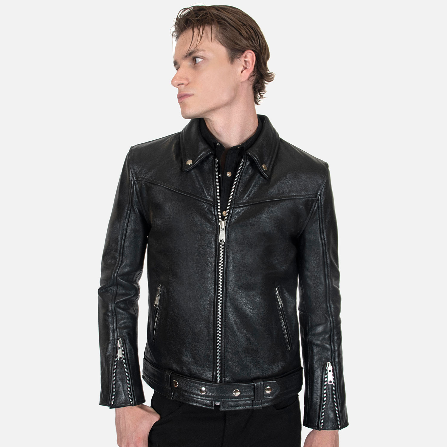 The Tribe leather jacket keeps things simple without sacrificing character. The diagonal chest seam detailing adds a subtle edge without complicating the design. A unique snap belt gives this classic style its own identity. Featuring a snap collar, vertical zipper closure, side pockets, and our Modern fit. All the attitude of a classic moto jacket, with a clean look that works just about anywhere. Made from premium leather that softens, relaxes, and conforms to your shape with wear, only getting better over time.